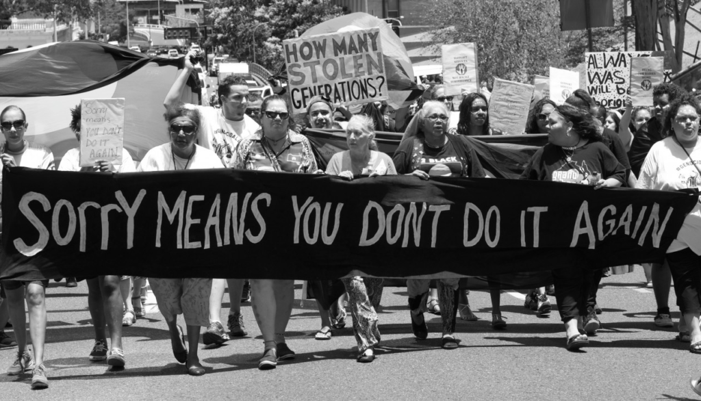 Photo taken of a protest march in 2014. Original image on www.stopstolengenerations.com.au