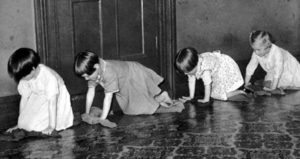 children scrubbing floor at Havilah