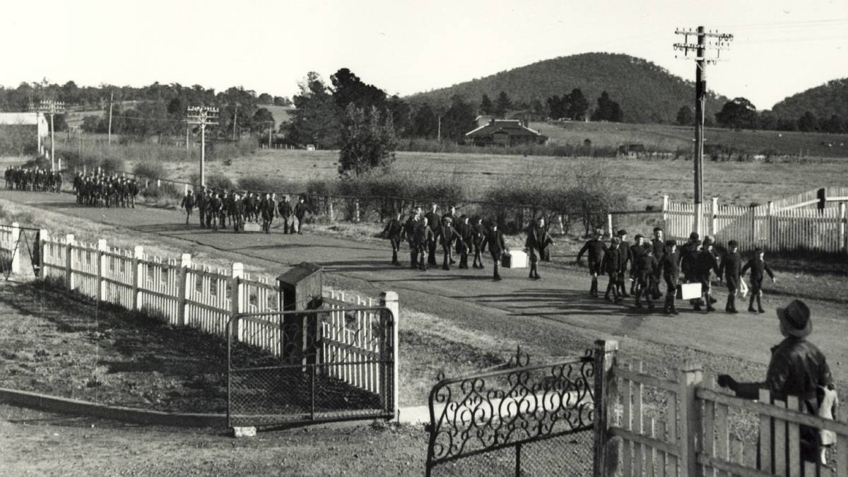 Boys marching to school