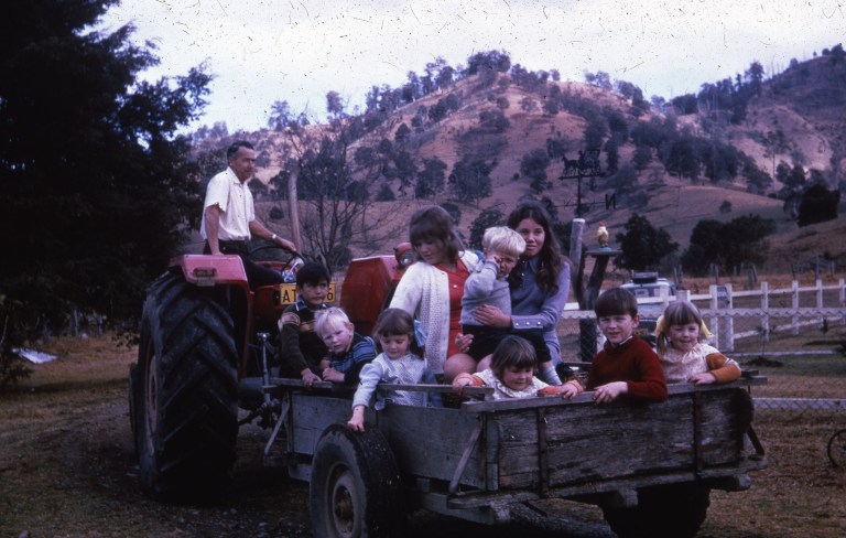 Children in the back of a tractor driven wagon